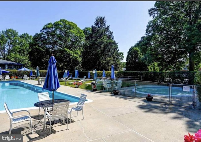 view of swimming pool featuring a patio area