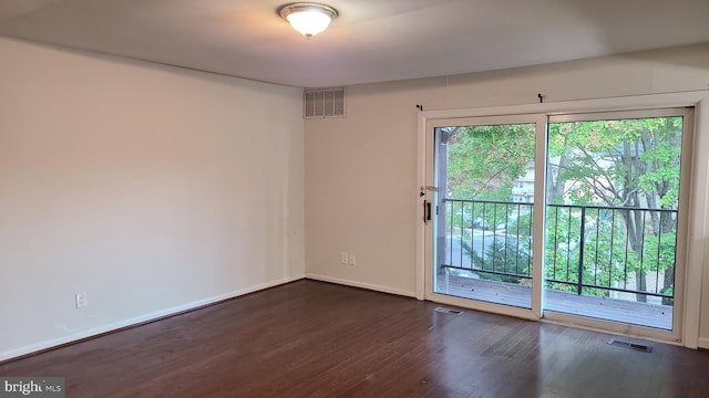 empty room featuring dark hardwood / wood-style floors