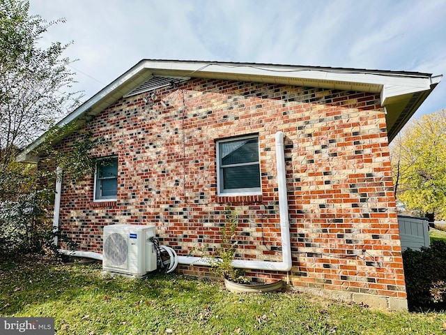 view of side of home featuring ac unit