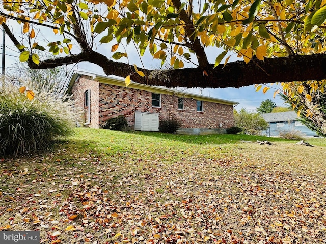 view of property exterior with a yard