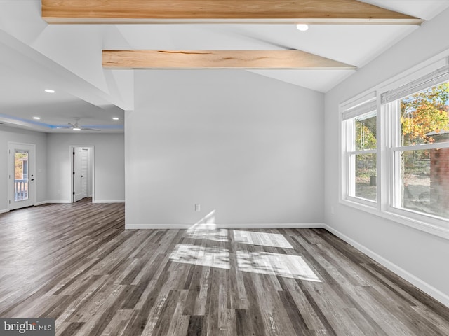 empty room with wood-type flooring, lofted ceiling with beams, and ceiling fan