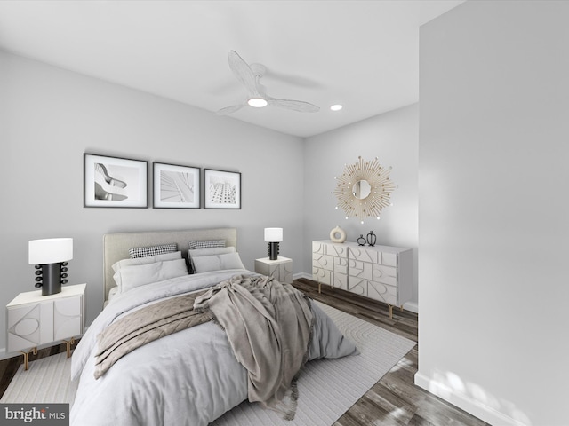 bedroom with ceiling fan and dark hardwood / wood-style flooring