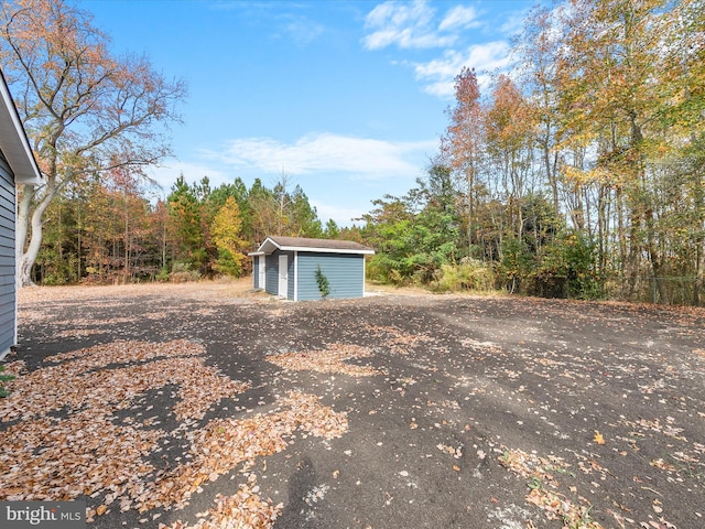 exterior space with a storage shed