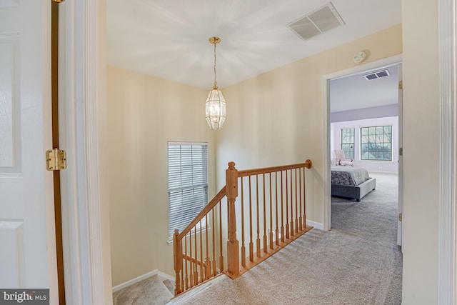 corridor with light colored carpet