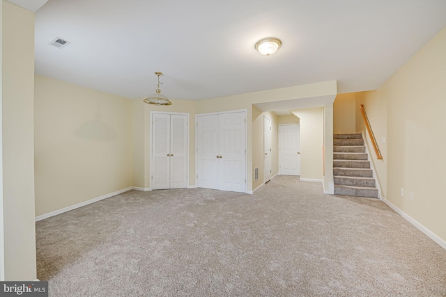 spare room with light colored carpet