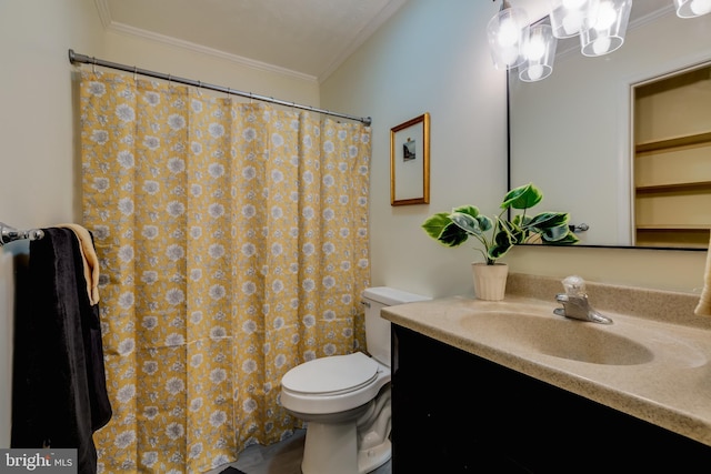 bathroom with vanity, toilet, and ornamental molding