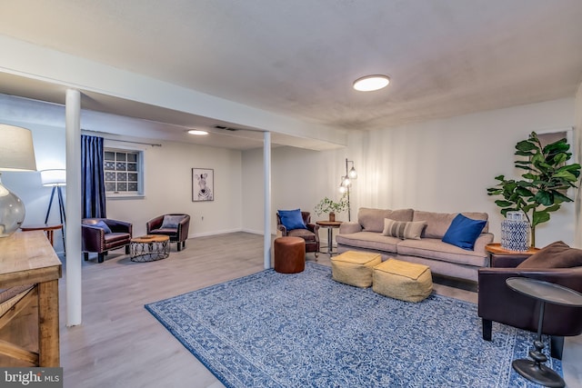 living room with light hardwood / wood-style flooring