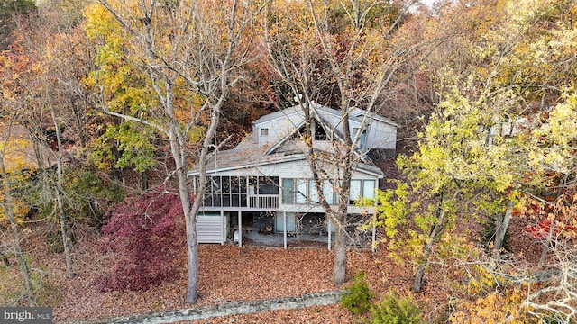 back of house with a wooden deck