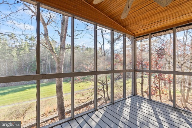 unfurnished sunroom with vaulted ceiling and wooden ceiling