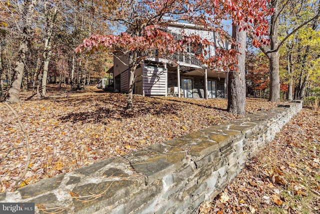 view of property exterior with a deck