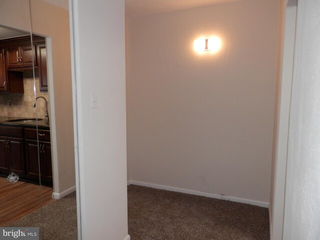 12 Dougherty Blvd Unit A5, Glen Mills, PA 19342 - interior space featuring carpet flooring, backsplash, baseboards, and a sink