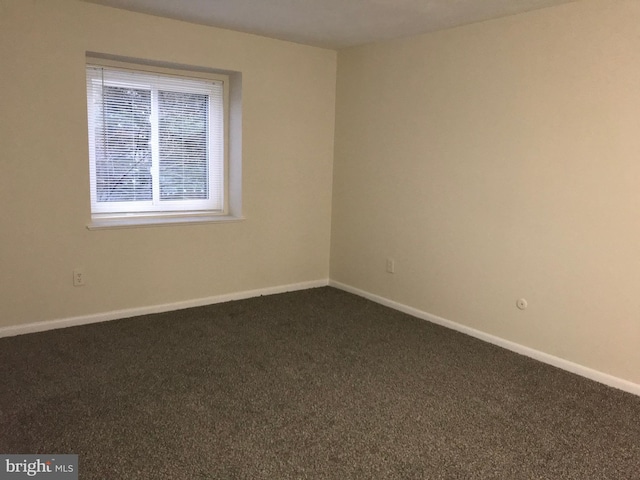 12 Dougherty Blvd Unit A5, Glen Mills, PA 19342 - empty room featuring dark colored carpet and baseboards