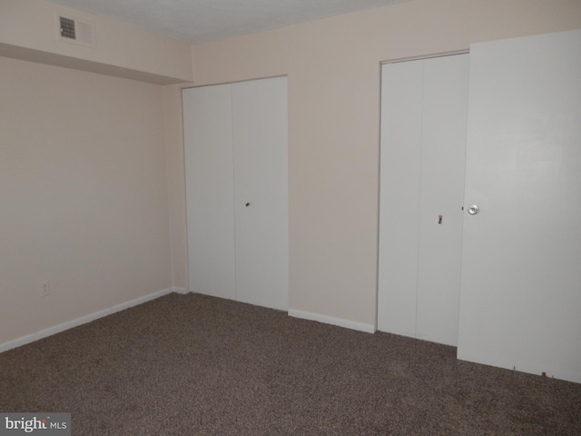12 Dougherty Blvd Unit A5, Glen Mills, PA 19342 - unfurnished bedroom featuring two closets, carpet floors, and visible vents
