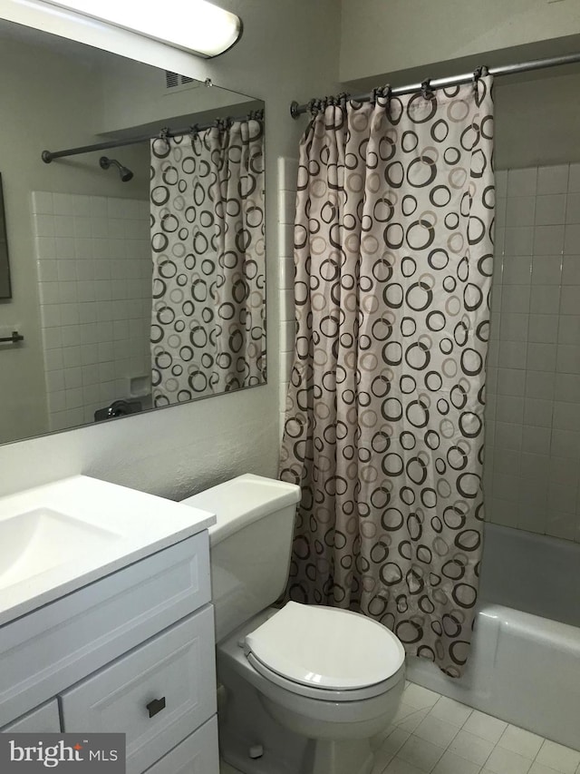 full bathroom with vanity, toilet, shower / bath combination with curtain, and tile patterned flooring