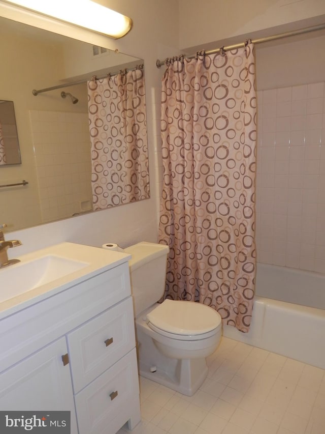 full bathroom featuring vanity, toilet, and shower / bathtub combination with curtain