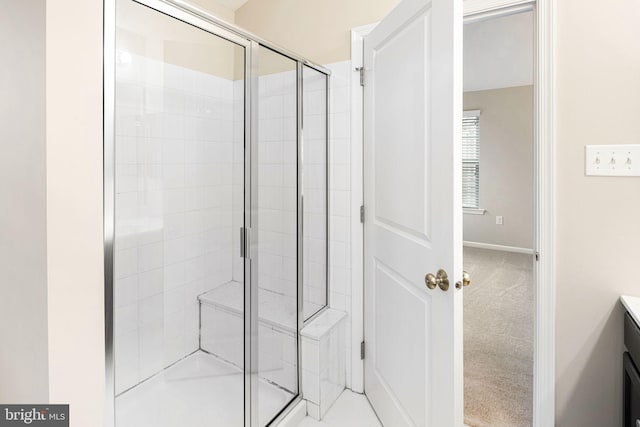 bathroom with vanity and an enclosed shower