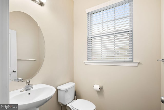 bathroom with toilet and sink