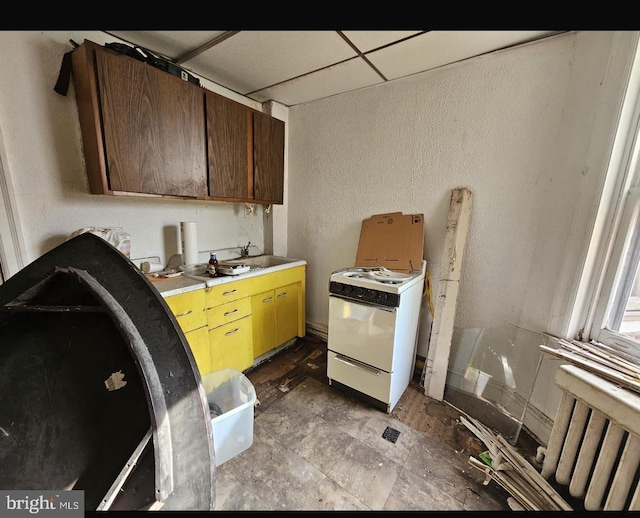 1028 W Olney Ave, Philadelphia, PA 19141 - kitchen featuring gas range gas stove, light countertops, a paneled ceiling, radiator, and a textured wall