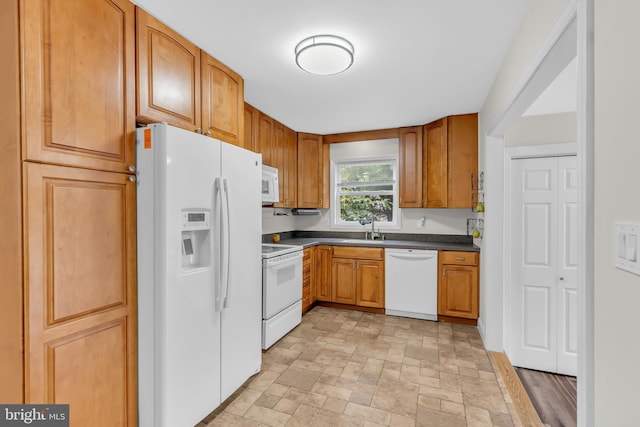 kitchen with sink and white appliances