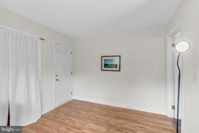 unfurnished room with light hardwood / wood-style floors