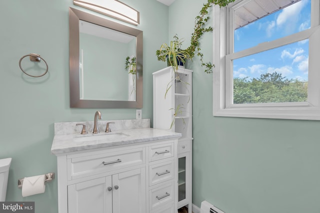 bathroom with vanity and toilet