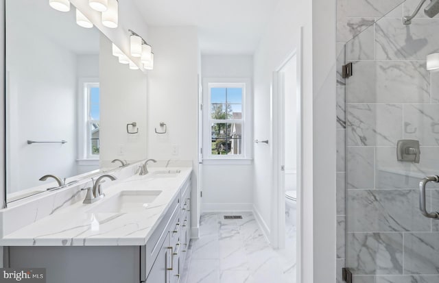 10812 Willow Ter, Fairfax, VA 22030 - full bathroom featuring marble look tile flooring, double vanity, a stall shower, toilet, and baseboards