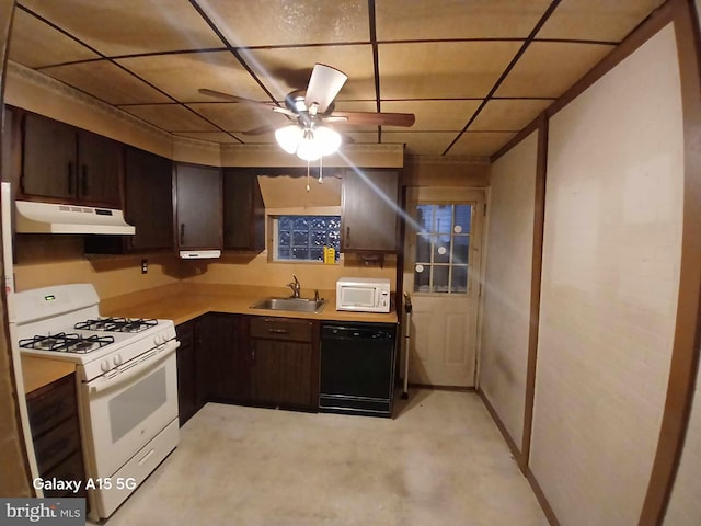 kitchen featuring dark brown cabinets, sink, white appliances, and ceiling fan