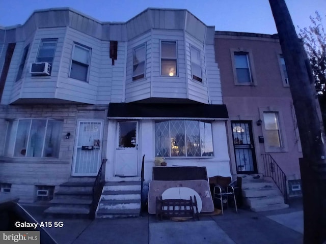 view of front of home featuring cooling unit