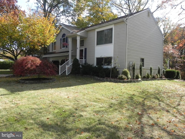 view of home's exterior featuring a lawn