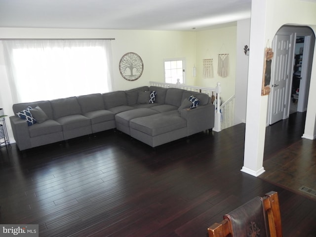 living room with dark hardwood / wood-style flooring