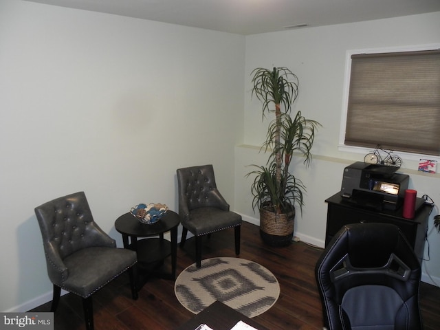 sitting room featuring dark hardwood / wood-style flooring