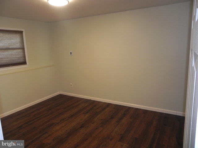 spare room featuring dark hardwood / wood-style flooring