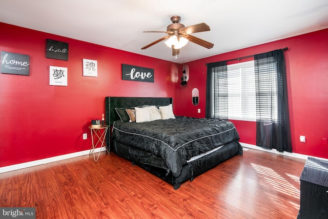 bedroom featuring ceiling fan and hardwood / wood-style floors