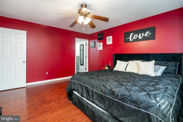 bedroom with ceiling fan and dark wood-type flooring