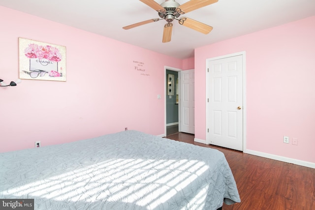 bedroom featuring ceiling fan and dark hardwood / wood-style floors