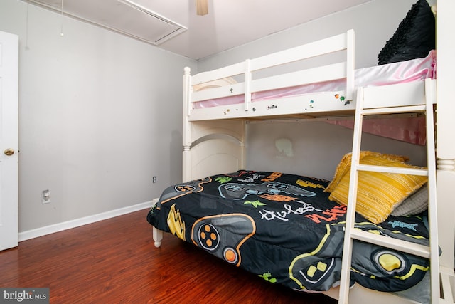 bedroom featuring dark hardwood / wood-style floors and ceiling fan