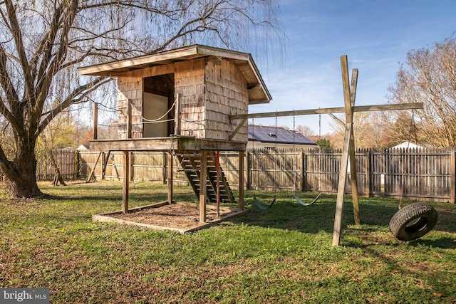 view of playground with a yard