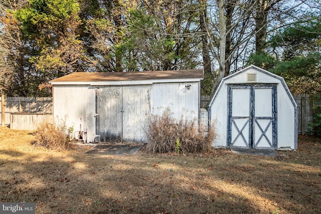 view of outbuilding with a yard