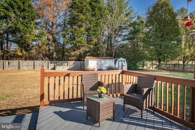 deck featuring a lawn and a storage shed