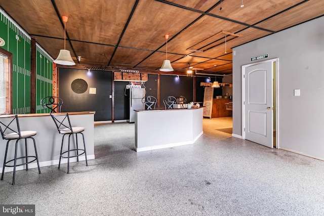 kitchen featuring stainless steel refrigerator and hanging light fixtures