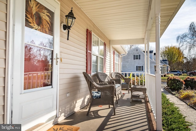 view of patio featuring a porch