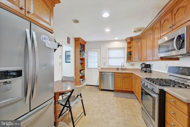 kitchen featuring stainless steel appliances and sink