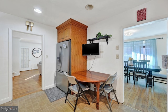 dining area with light hardwood / wood-style flooring