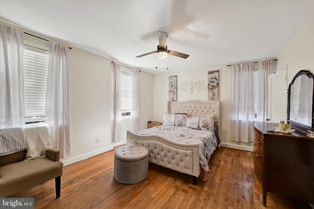 bedroom with hardwood / wood-style floors and ceiling fan