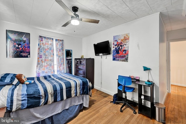 bedroom featuring hardwood / wood-style flooring and ceiling fan