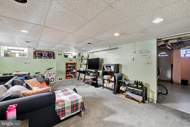 living room featuring a drop ceiling