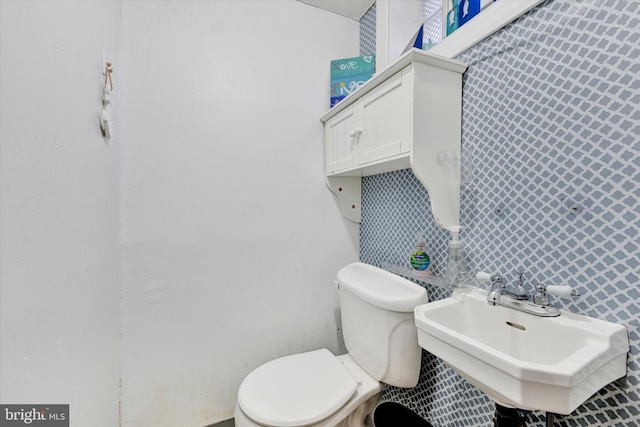 bathroom featuring sink and toilet