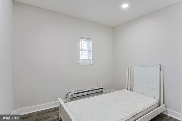 bedroom with dark wood-type flooring