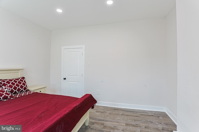 bedroom featuring wood-type flooring