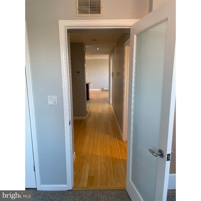 hallway featuring hardwood / wood-style floors